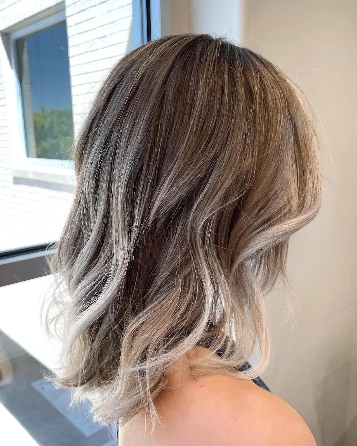 Balayage hair color transformation at Lee Graves Salon in Plano, TX