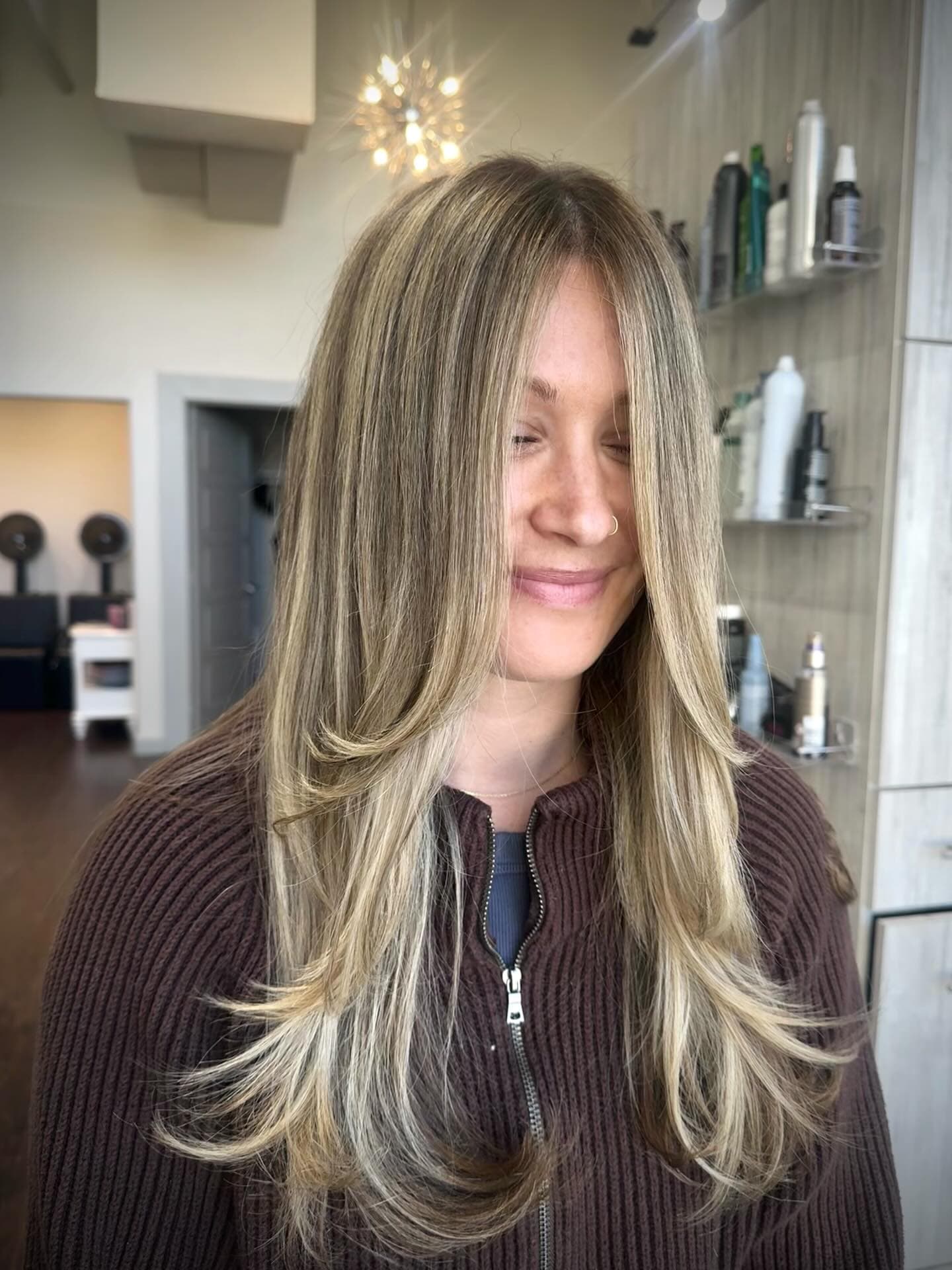 Blended dimensional blonde with a soft grow-out line, colored at Lee Graves Salon in Plano, TX