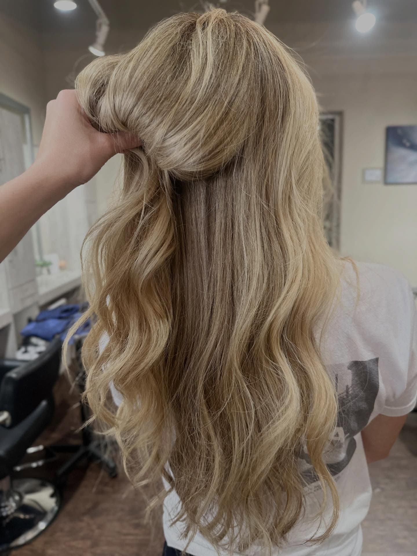 Balayage color application at Lee Graves Salon in Plano, TX