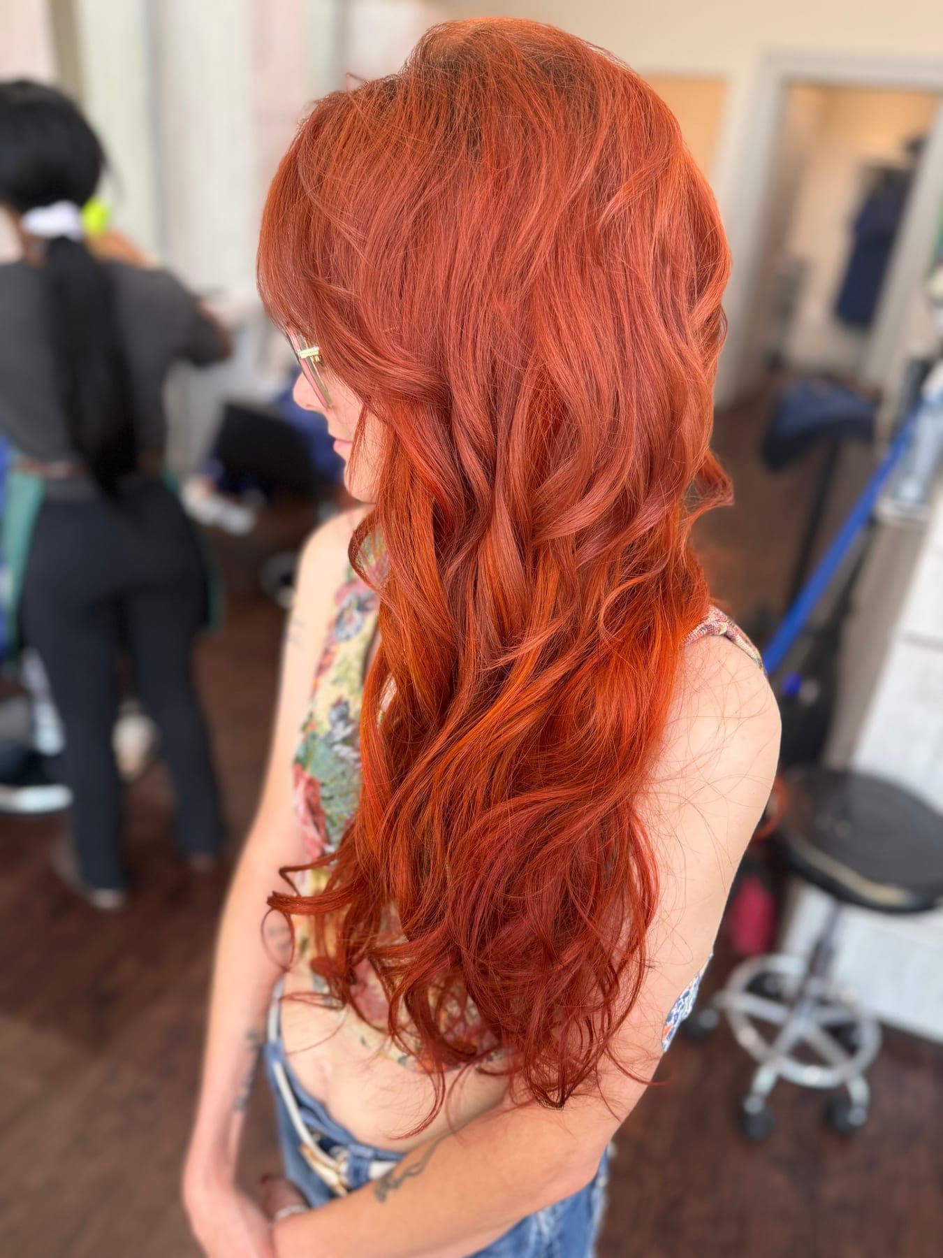 Long copper red hair with high shine and soft movement after a conditioning treatment at Lee Graves Salon in Plano