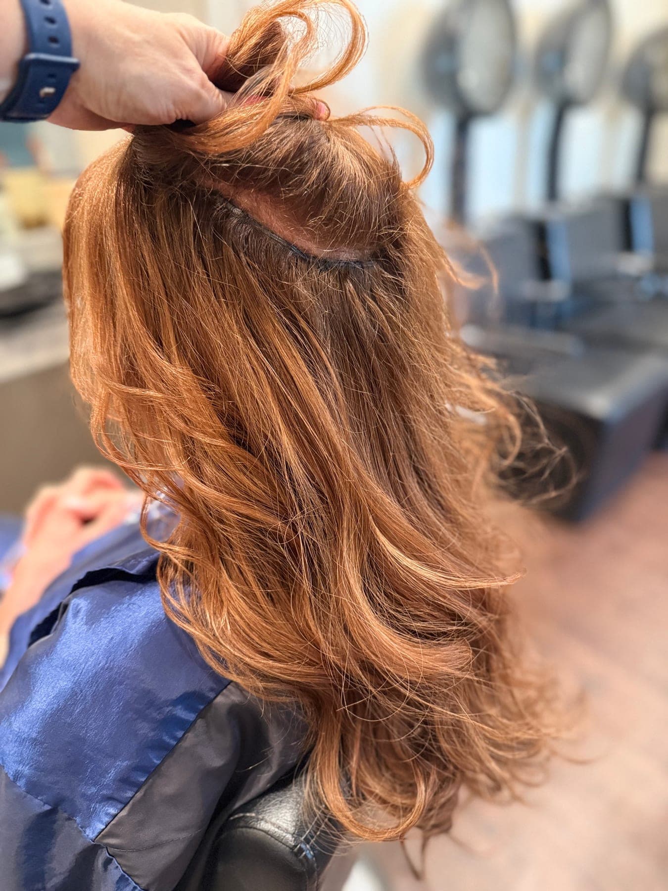 Long, full bridal hair with extensions styled for a wedding at Lee Graves Salon in Plano, TX