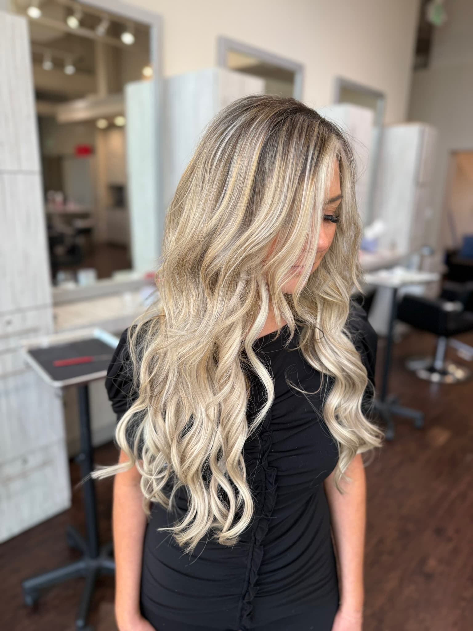 Hand-tied hair extensions installation at Lee Graves Salon in Plano, TX